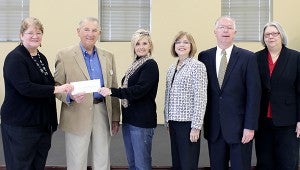 Submitted The gift of knowledge: Pearl River County Library System director Carol Phares, left, accepts a grant check from Dr. Ted Alexander, CEO of the Lower Pearl River Valley Foundation, and Stacy Wilkes, president of the Rotary Club of Poplarville. With them are EDC Educational Services consultants Kay and Bob Rhett and Cynthia Hornsby of the Poplarville Library.
