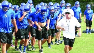 Pearl River Central head football coach Eric Collins leads his Blue Devils on to the practice field this past season. Collins has been named one of five finalists for the head coaching job at Hahnville, La. High School. Photo by Curtis Rockwell