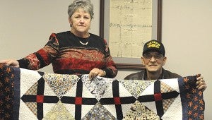 Alexandra Hedrick | Picayune Item Quilt of valor: Veteran’s Service Department of Pearl River County representative Cindy Smith and Retired Air Force veteran Dale Flora, display the Quilt of Valor that he was presented with for service in the armed forces. Photo by Alexandra Hedrick 