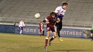 SHUTOUT: Picayune’s Tyler Polderman (17) and Pascagoula’s Hayden Hamm lock  up in an attempt to reach the ball in the first half of prep soccer playoff action at War Memorial Stadium Thursday night. Photo courtesy of the Mississippi Press