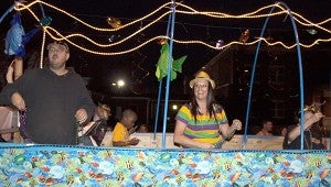 Valerie Lane Dorn is having a great time on the Wet and Wild Fun Jump float at Monday's Krewe of the Pearl Mardi Gras Parade. Jodi Marze | Picayune Item