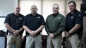 The Picayune Police Department is offering a free handgun safety course for women. Applications are available at the station. Shown from left are: , Jeremy Magri, Chief Bryan Dawsey and James Bolton.