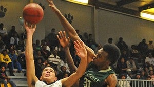 TOP TIGER: Moss Point Prep All-American Devin Booker goes up for a shot as Poplarville’s Emetric Fells challenges the shot Friday night. Photo by Tyler G. Myers of The Mississippi Press