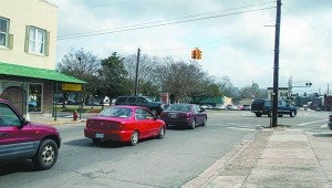 SIGNAL STAYING: Cars are lined up down West Canal waiting for the light to change. The city recently completed a traffic count at this intersection to help it determine any changes that may need to be made in the traffic signal’s timing. Photo by Will Sullivan
