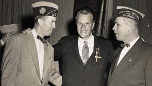 BURKS AND FRIENDS: From left: Then Representative Delos H. Burks, Adjutant –Quartermaster of VFW of Mississippi, the Reverend Billy Graham and Representative Jeff B. Williams of Lexington, Miss. Commander of VFW.  Photo submitted
