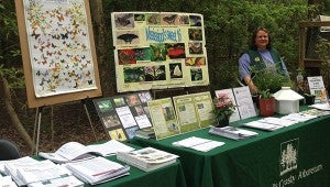 WHERE THE WILD THINGS ARE: Arboretum volunteer Amy Nichols enjoyed last year’s Earth Day festivities, discussing information on butterflies and other pollinators.  Photo by Pat Drackett
