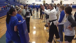 SELF DEFENSE: Forty-five Pearl River Central High School female juniors and seniors take self-defense classes from Picayune Taekwondo owner Bret Barras.  Photo submitted