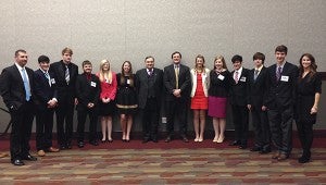 MODEL STUDENTS: From left, Pearl River Central model security council co-sponsors Brandon Herrin and Debra McCormick with students Blake McCormick, Ralph Powers, Korey Hosch, Brittany Kennedy, Kristin Holmes, Morgan Thompson, Abby Carter, Reed McCormick, Skylar Taggart, Tyler Hartman at the 2014 Mississippi Model Security Council at Mississippi State University. In the center are former Iraq United Nations Ambassador Feisal Istrabadi and Mississippi State Univeristy faculty advisor Dr. Brian Shoup.  Photo submitted 