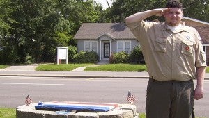 EAGLE SCOUT: Eagle Scout Albert “A.J.” Linzell stands next his service project, a flag retirement facility located near Picayune City Hall. Submitted