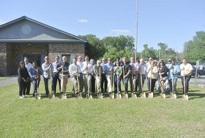 SHOVELS READY: City of Picayune and Pearl River County officials joined local business members and the Greater Picayune Area Chamber of Commerce in the ground breaking held by Mississippi Power for their new location on Weest Canal Street. Photo submitted