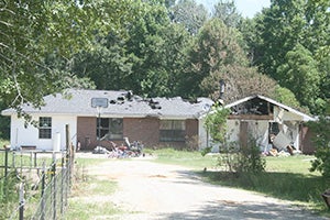 FIRE DAMAGE: A fire Saturday night destroyed this home on Shelton Pearson Road. Photo by Jeremy Pittari