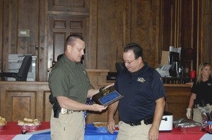 RETIREMENT: Picayune Police Chief Bryan Dawsey, left, presented Maj Ricky Frierson with a plaque for his more than 30 years of service to the department at his retirement party held Wednesday. Photo by Cassandra Favre