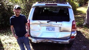 Jesse Wright | Picayune Item SMASHED: Josh Detrick stands next to his smashed Toyota SUV. Detrick said he was rear-ended and the driver then fled.