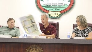 Mayor Ed Pinero looks over plans for a pavilion at Mildred Mitchell Park, which will be constructed with donated supplies from the Pearl River County Homebuilders Association.  Photo by Jeremy Pittari.